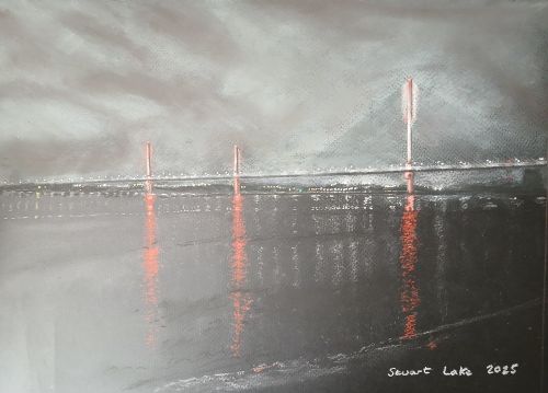 Mersey Gateway bridge lit up after dark